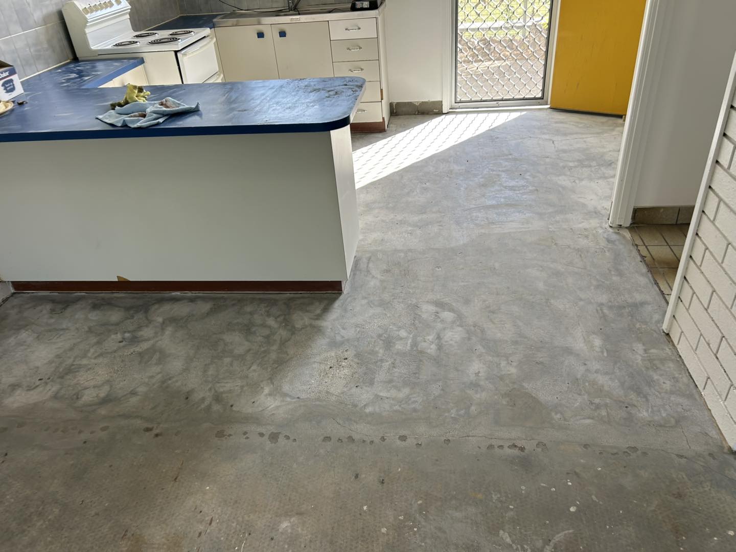 Worn and broken flooring before renovation