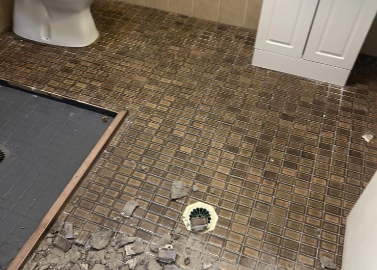 Broken tiles in the bathroom ready to be replaced